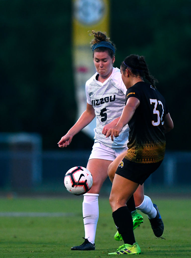 Missouri midfielder Grace Kitts and Southern Mississippi midfielder Keely Hoppmeyer fight for the ball